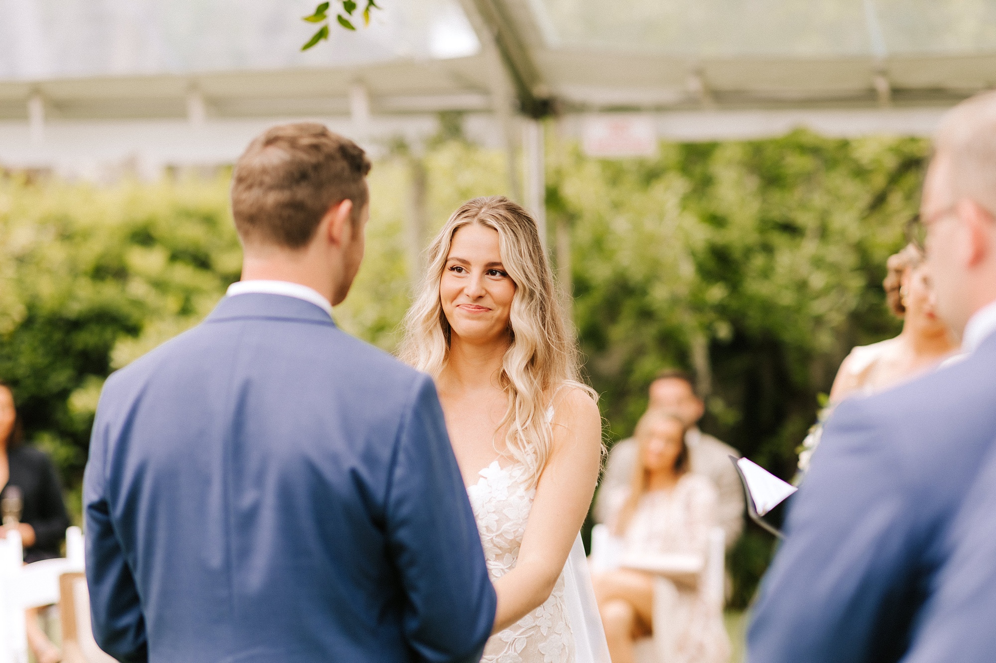 bride and groom exchange vows during spring Wrightsville Manor wedding ceremony 