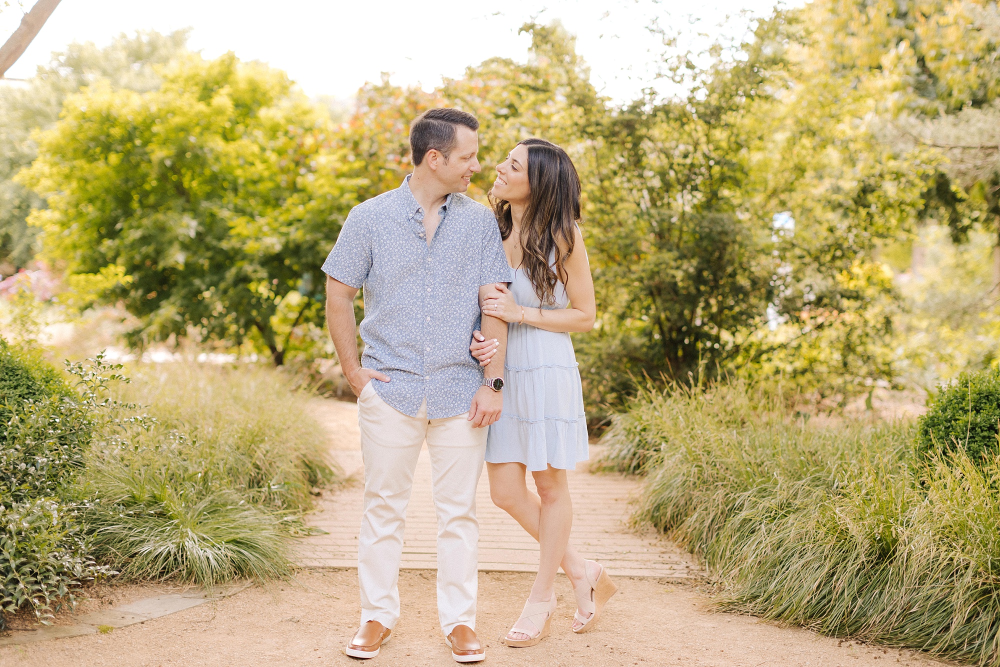engaged couple walks through JC Raulston Arboretum