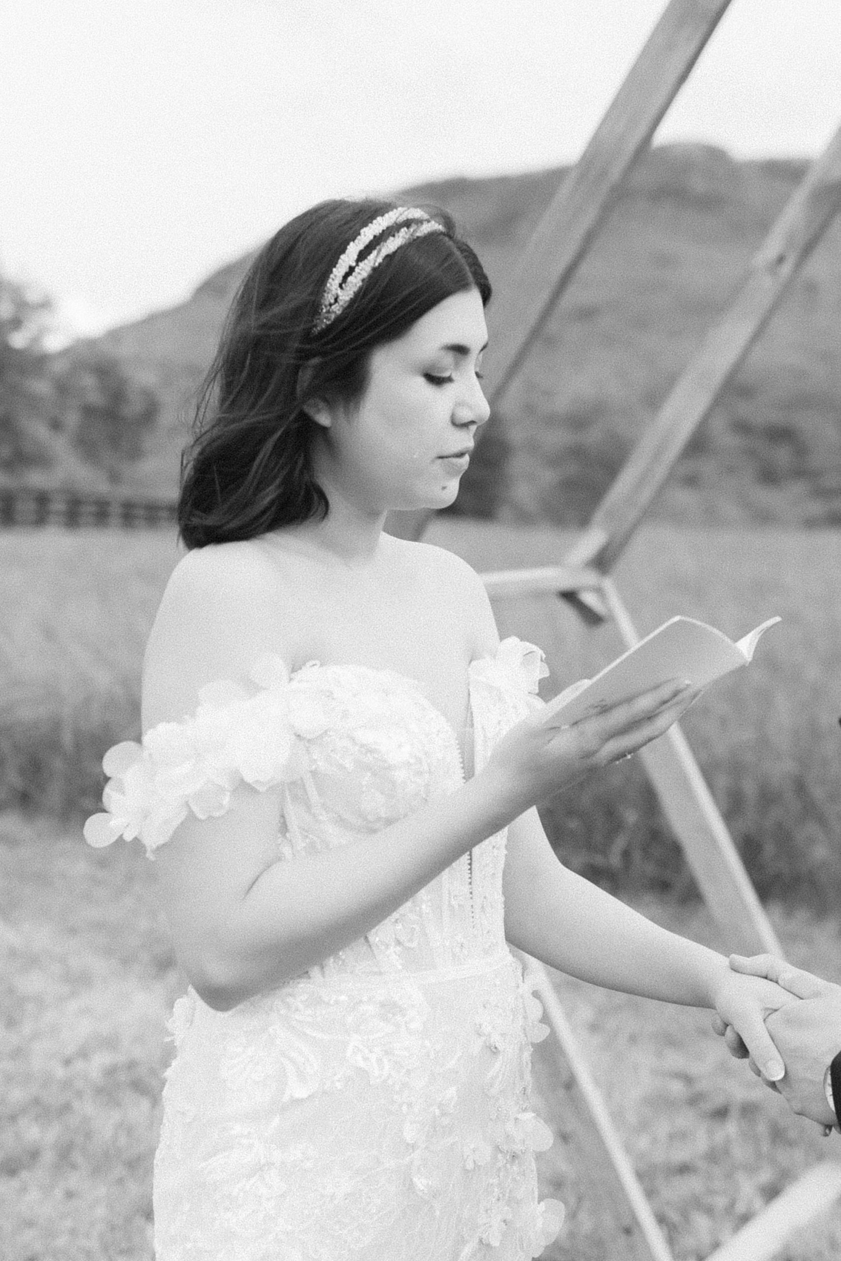 bride reads vows to groom during ceremony