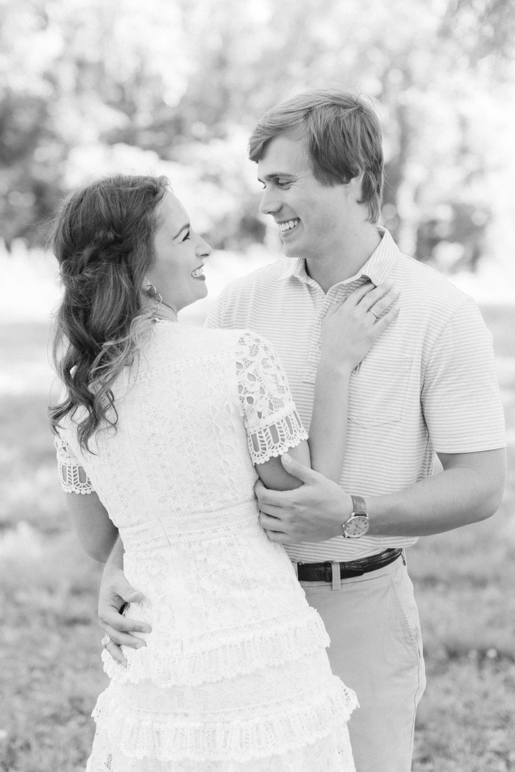 bride and groom laugh together during Reynolda Gardens engagement photos