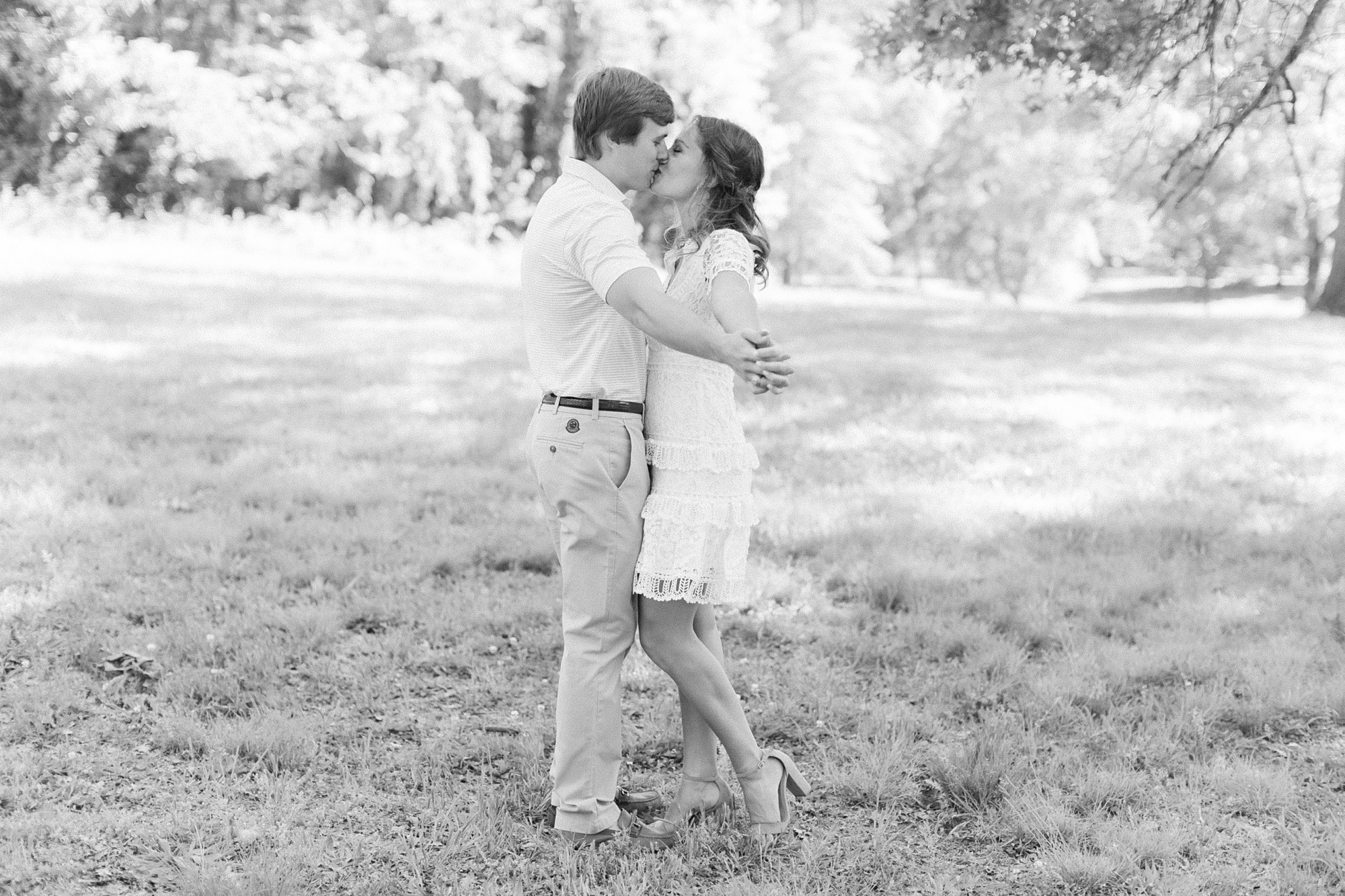 bride and groom kiss during Reynolda Gardens engagement session