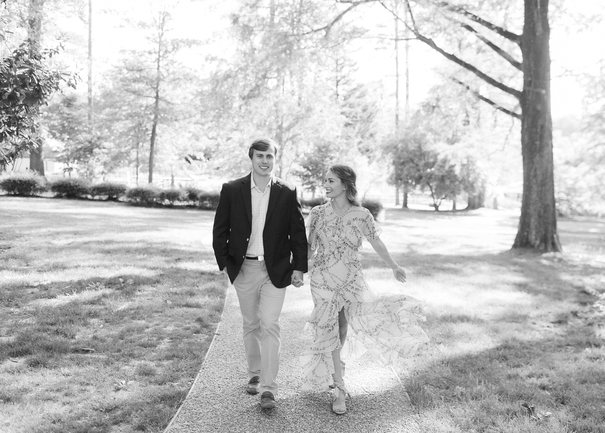 engaged couple walks through Reynolda Gardens