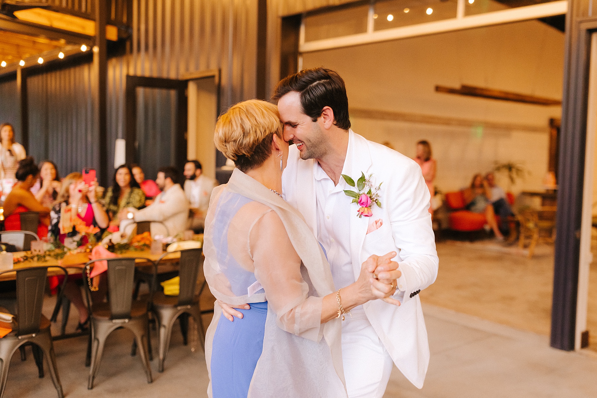 groom dances with mom during Raleigh NC wedding reception