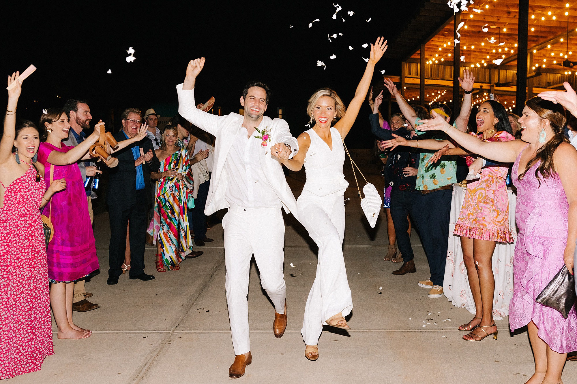 newlyweds leave Raleigh NC wedding reception with confetti toss