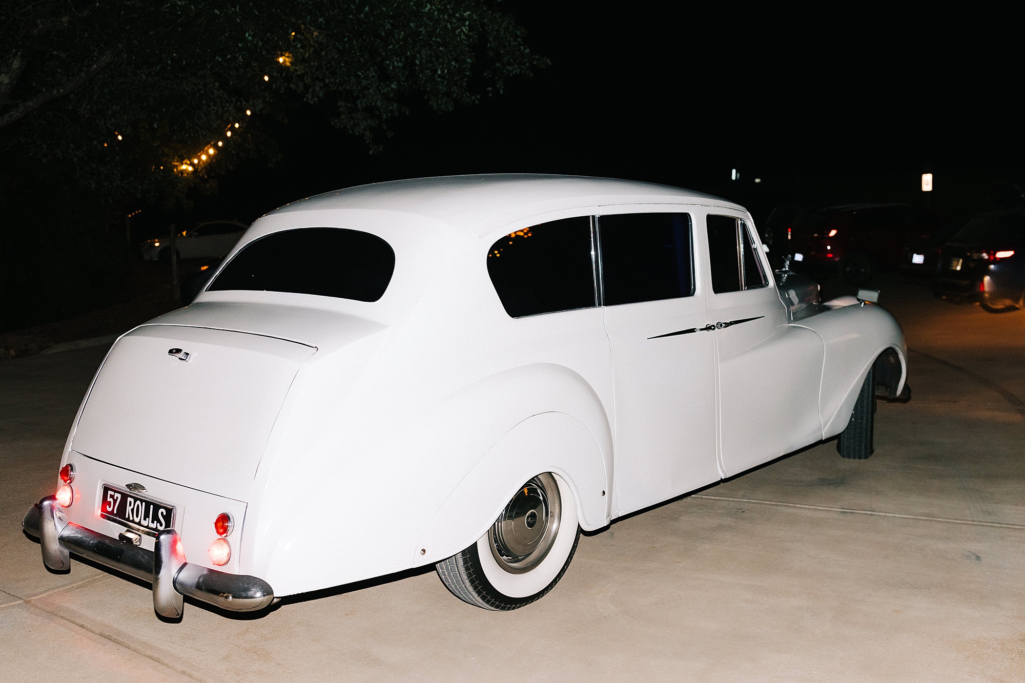 vintage white car outside Raleigh NC wedding reception