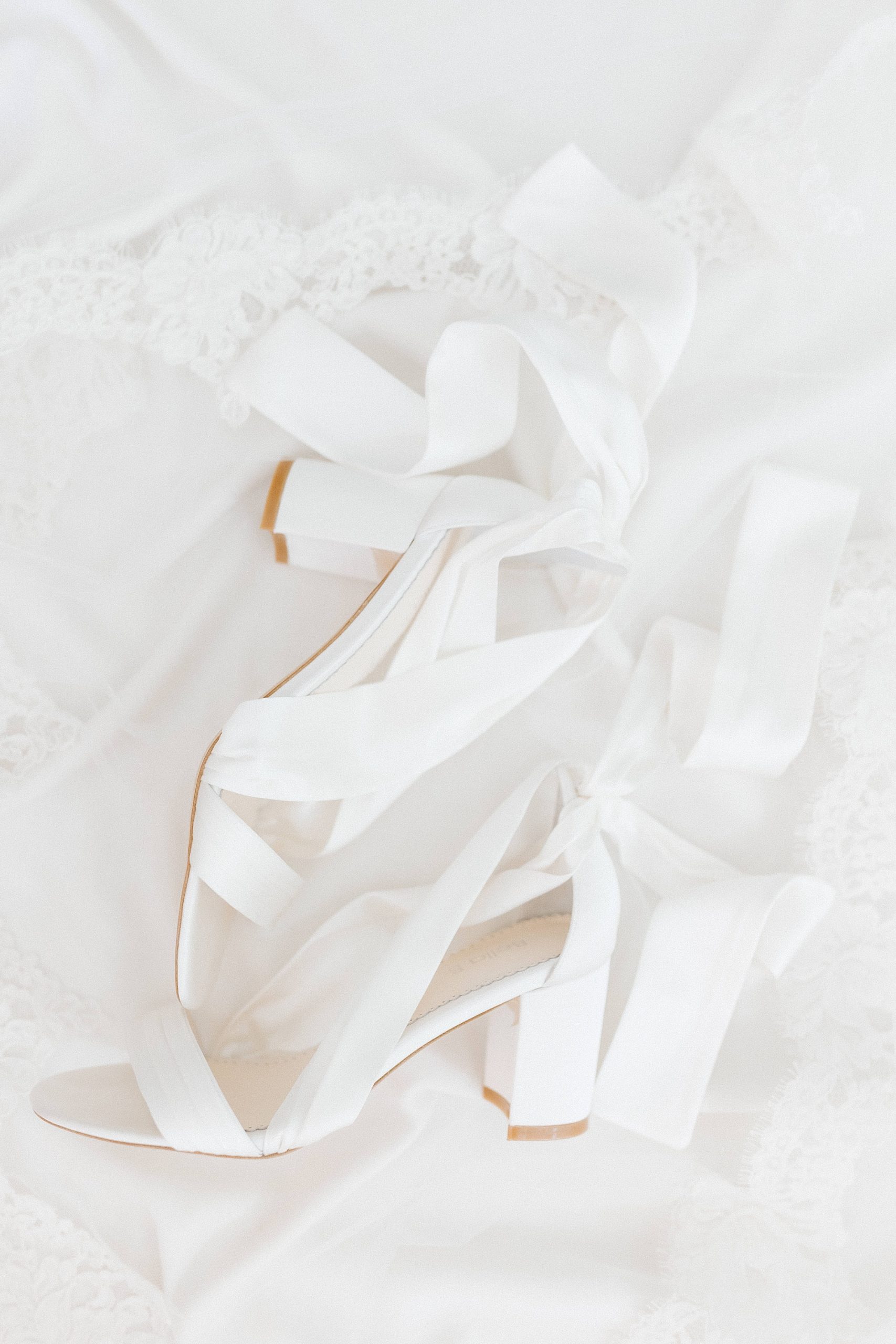 bride's white shoes for summer wedding day