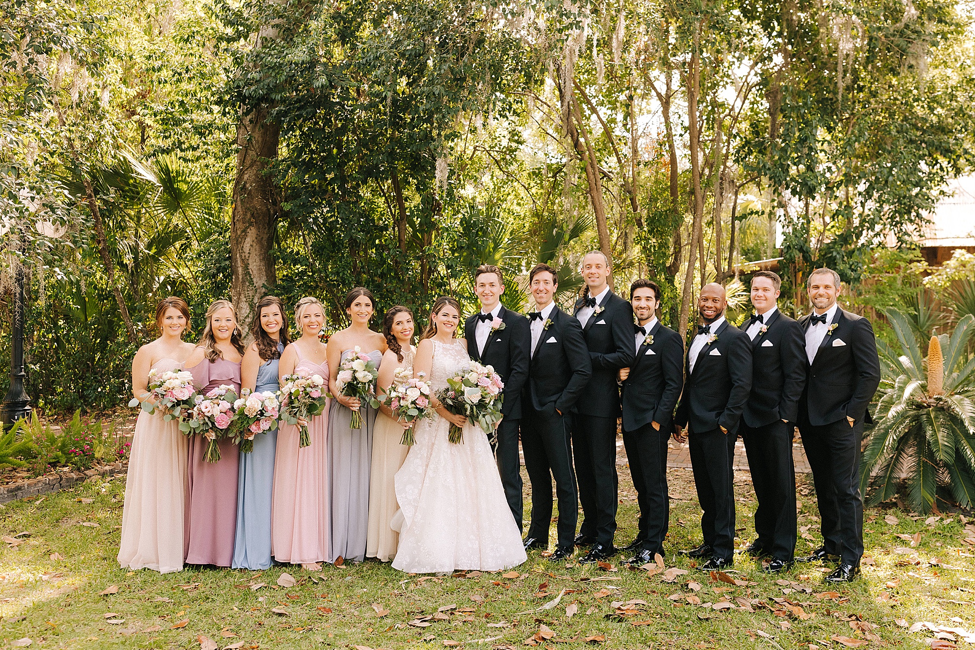 newlyweds pose with bridal party in Florida 