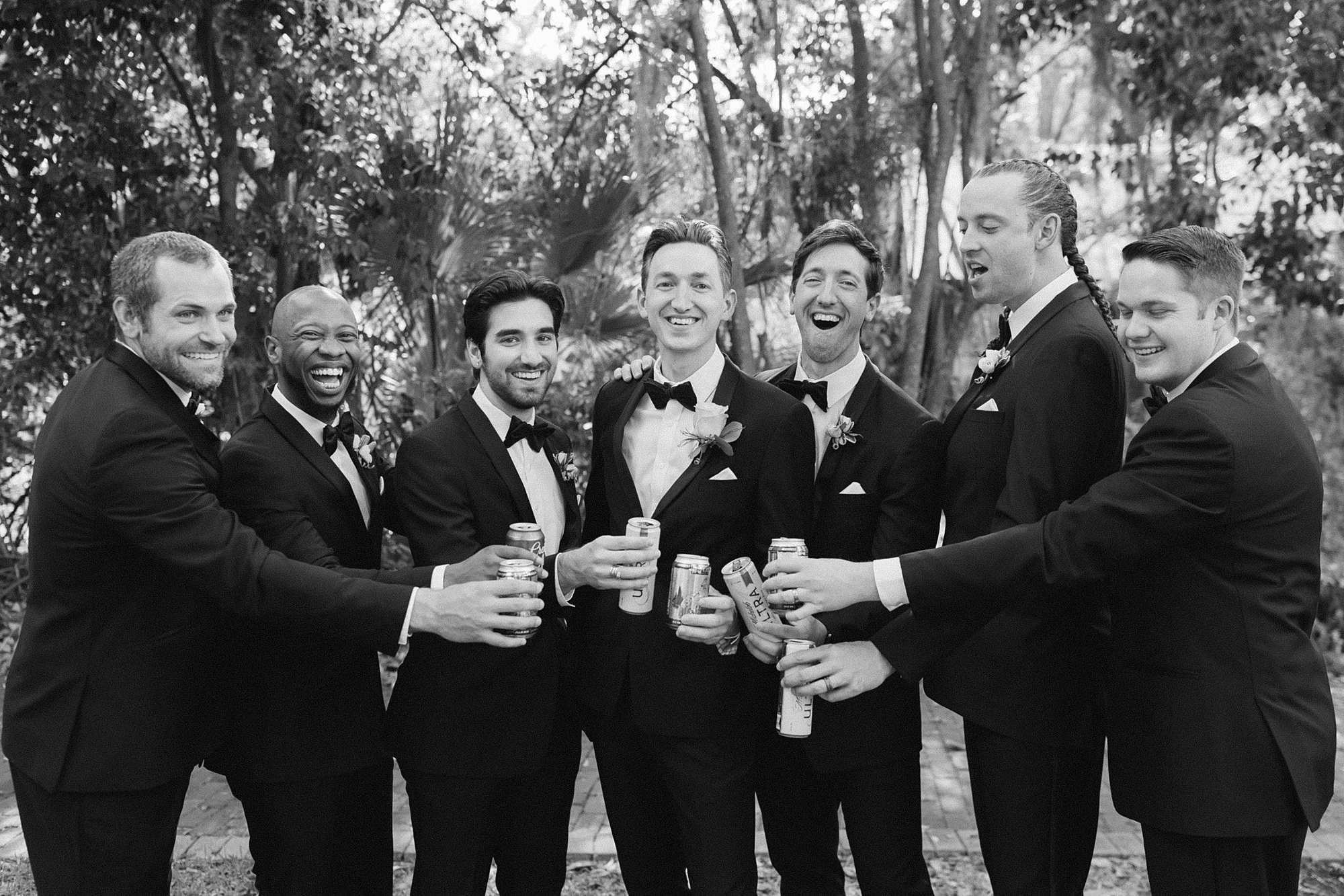 groom toasts with groomsmen 