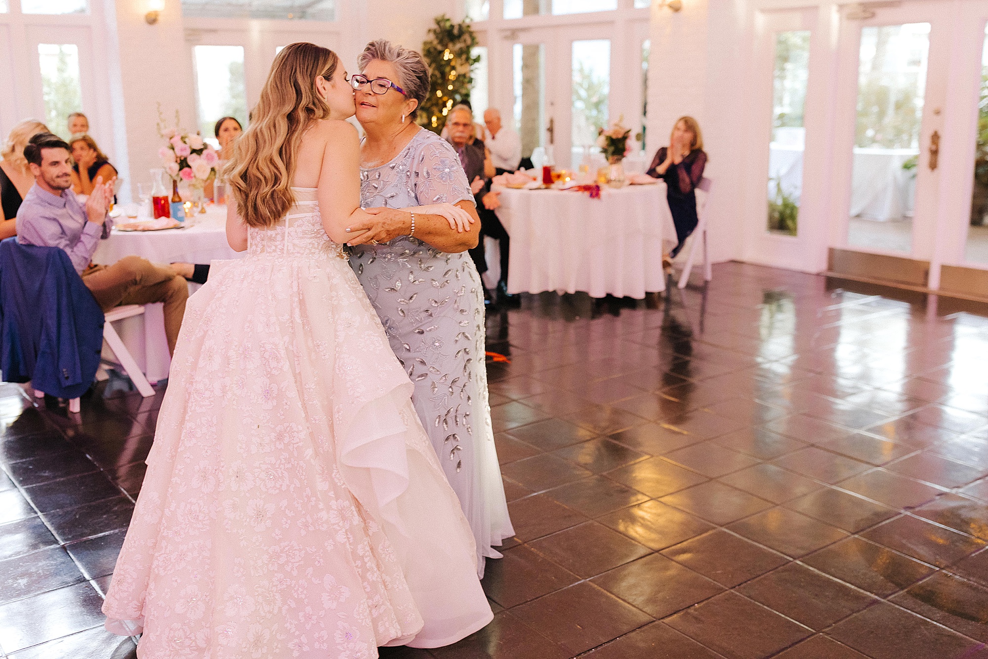 bride dances with mother during FL wedding reception