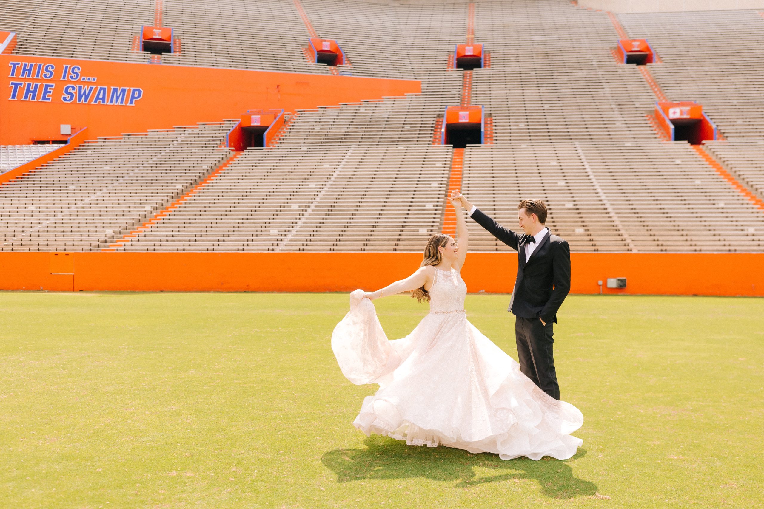 couple celebrates wedding day at the Gator stadium in Gainesville, FL
