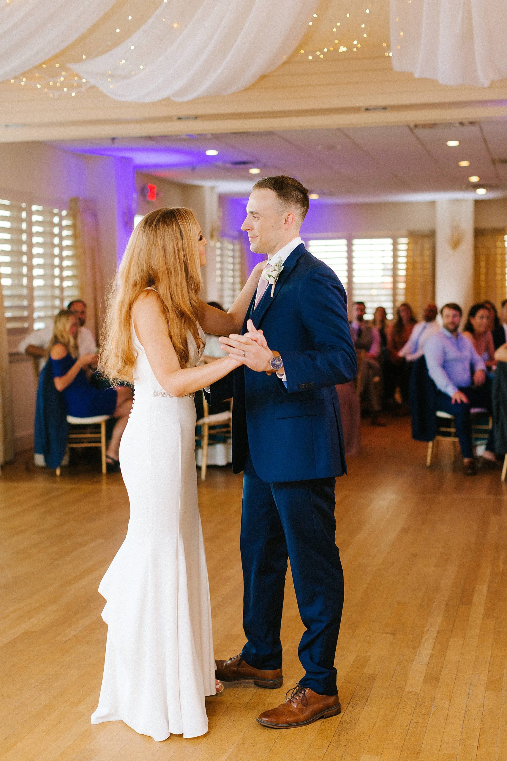 bride and groom have first dance during Virginia Beach wedding reception