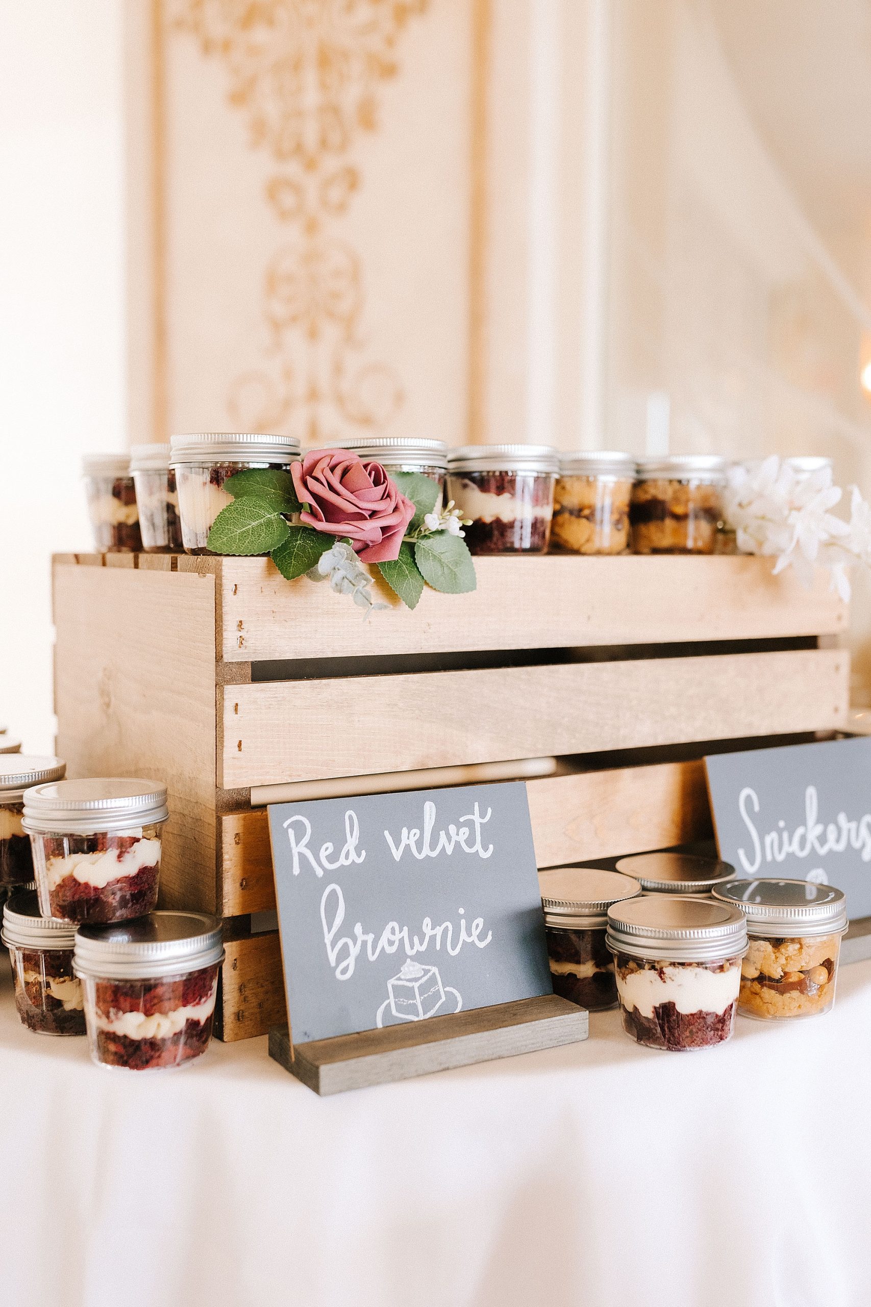 dessert display in mason jars for wedding reception 