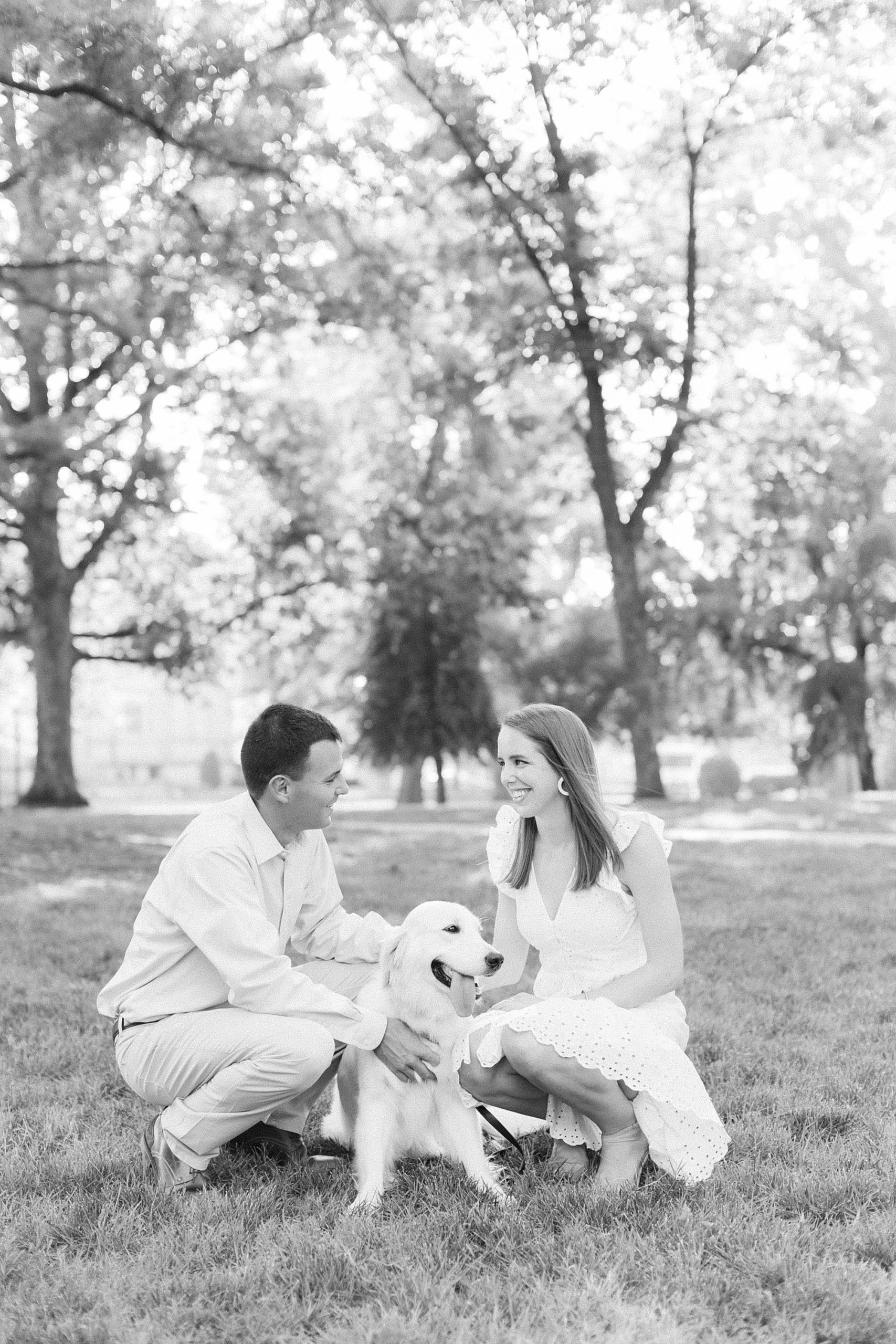 bride and groom pose with dog at UNC Chapel Hill