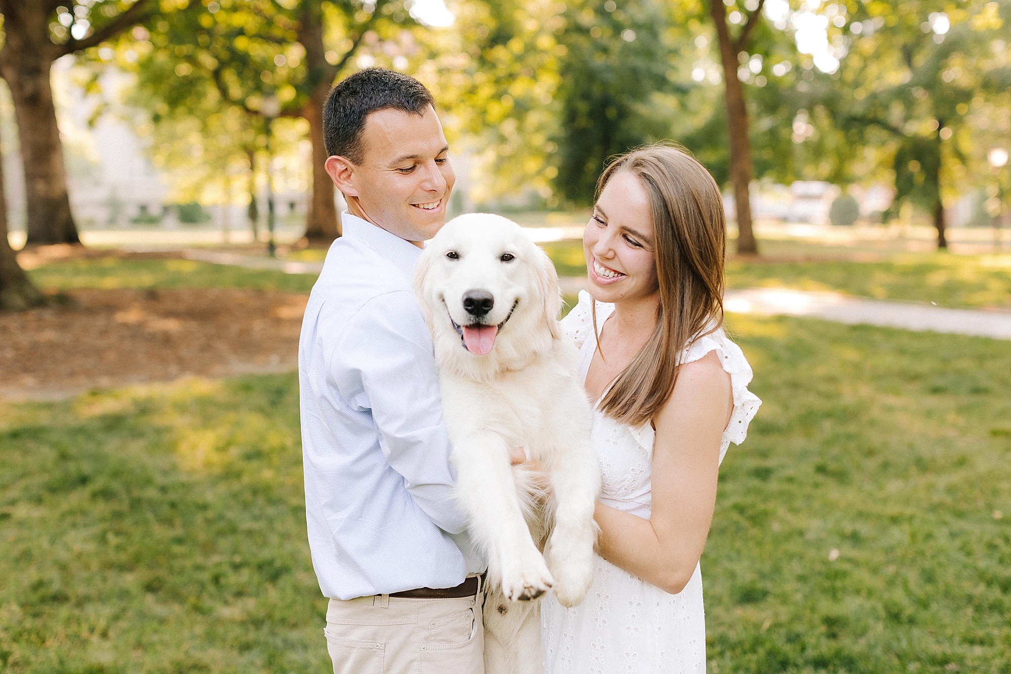 engagement portraits with white dog at UNC Chapel Hill