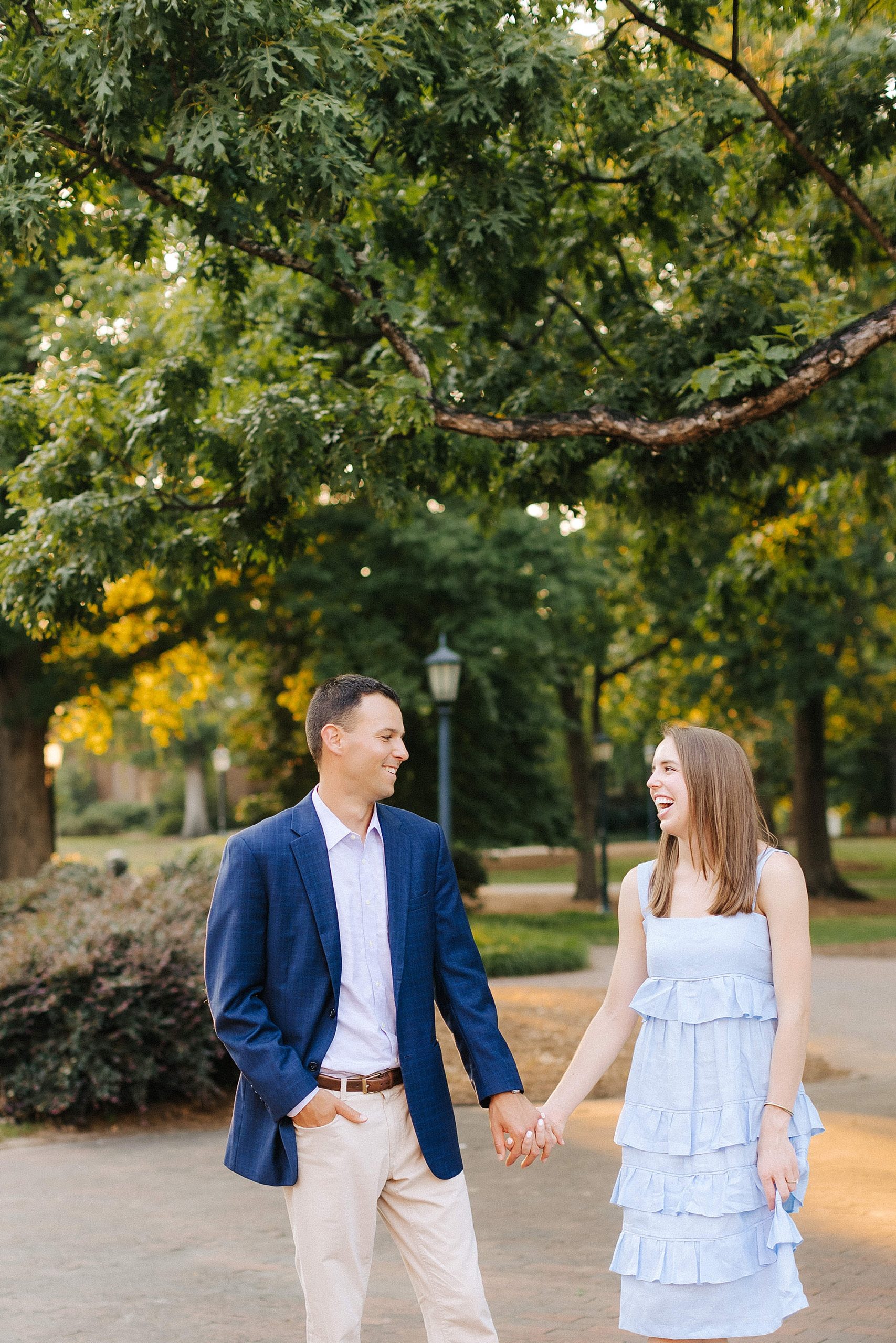 engaged couple walks through campus in Chapel Hill