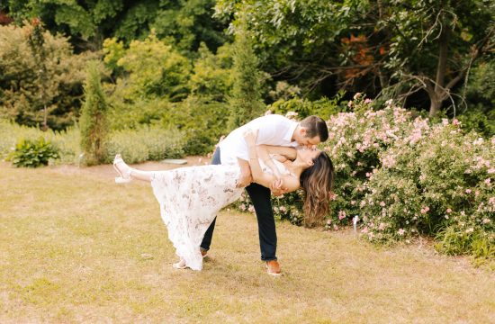 engaged couple dances in JC Raulston Arboretum in Raleigh, North Carolina