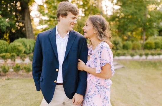 engaged couple laugh together at Reynolda Gardens in Winston-Salem, NC