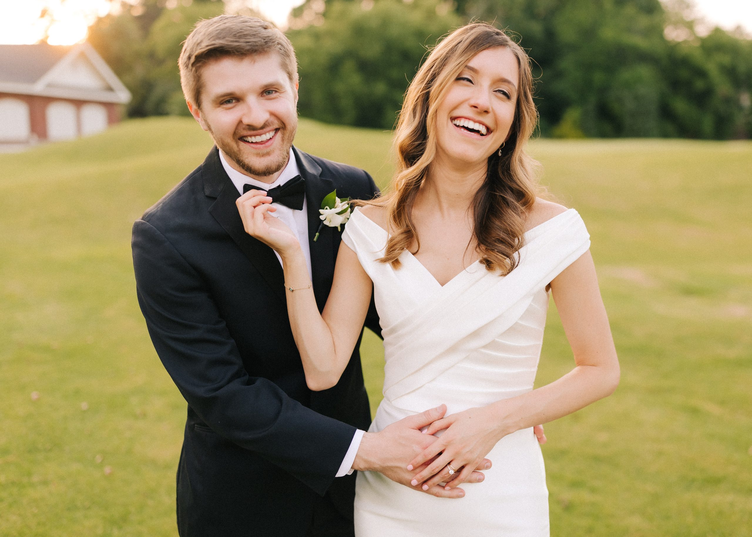 couple laughs on their wedding day at prestonwood country club in raleigh, nc