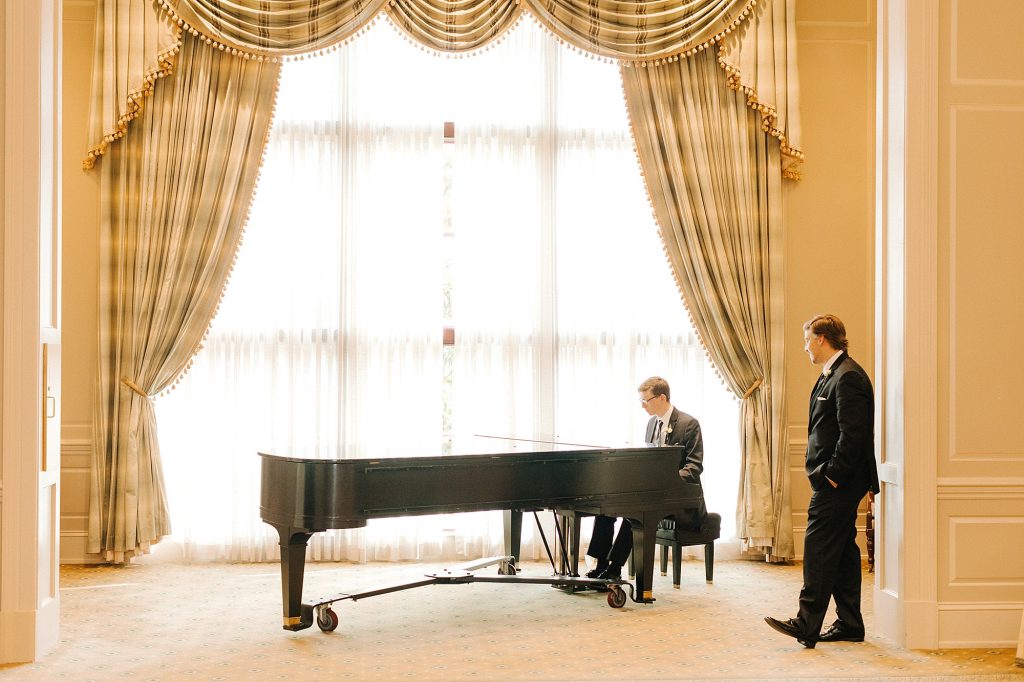 groom plays piano at Prestonwood Country Club