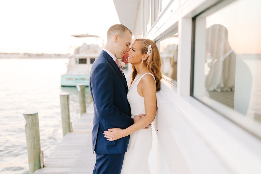bride and groom enjoy sunset outside of Lesner Inn on their wedding day