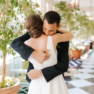 Couple hugs during their first look at The Carolina Inn