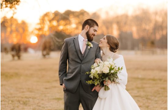 A couple smiles together at sunset on their wedding day at The Barn at Valhalla