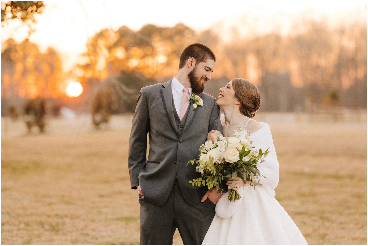 A couple smiles together at sunset on their wedding day at The Barn at Valhalla