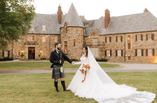 A couple stands in their scottish attire in front of The Graylyn Estate on their wedding day in Winston-Salem.