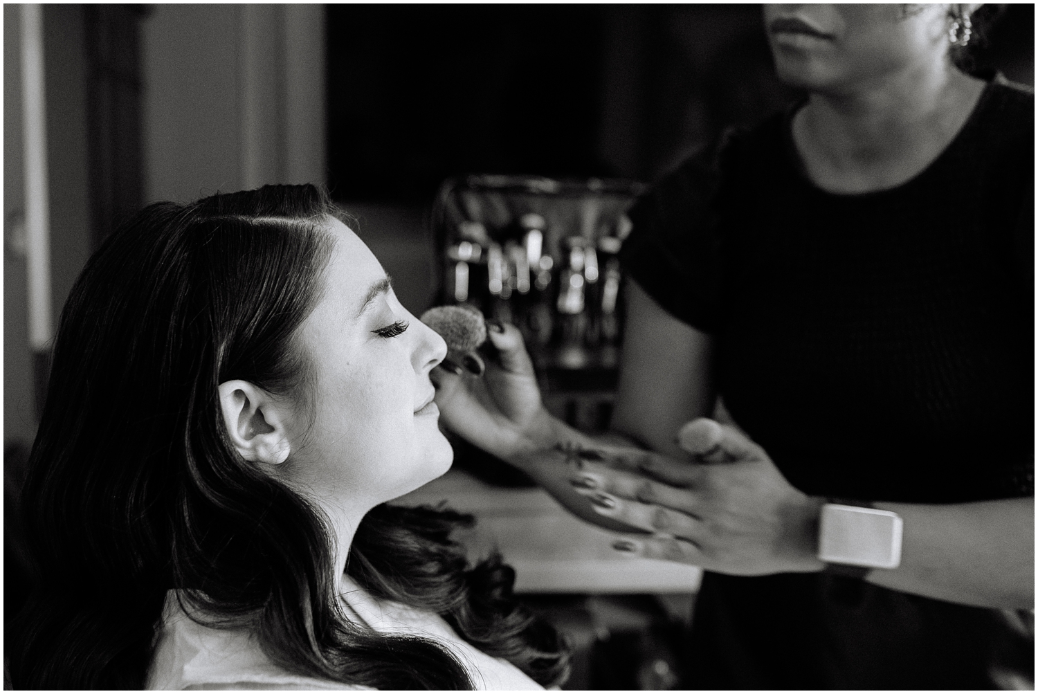 Bride gets makeup final touches on her wedding day in Tampa, FL