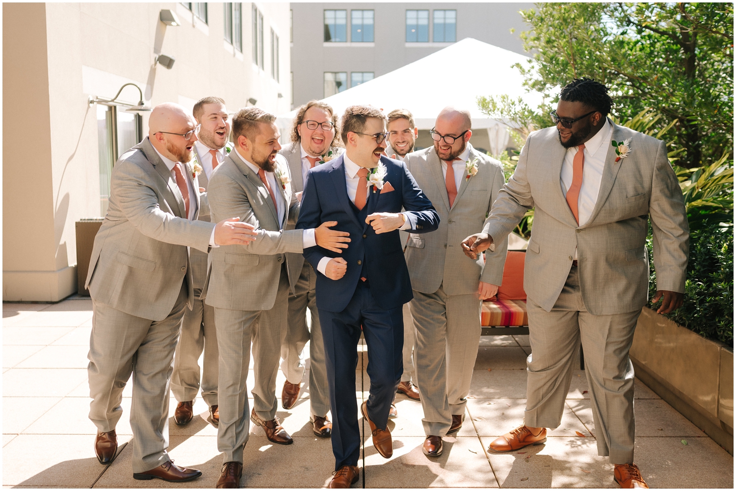 Groom with his groomsmen laughing in Tampa, FL