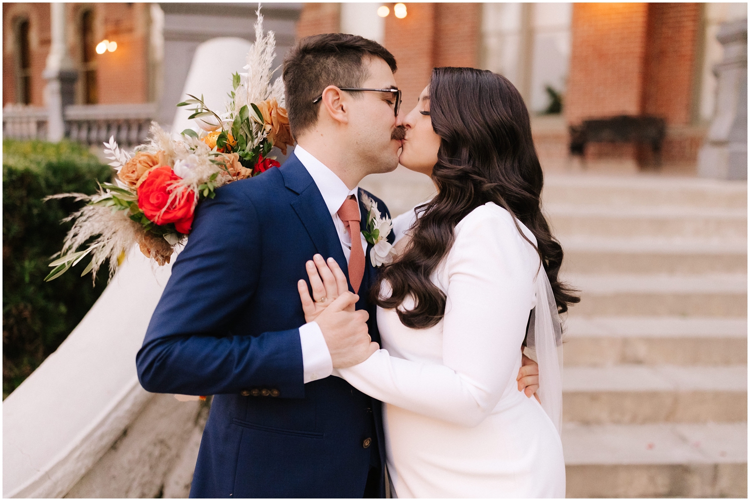couple shares a kiss after their wedding ceremony in Tampa, FL