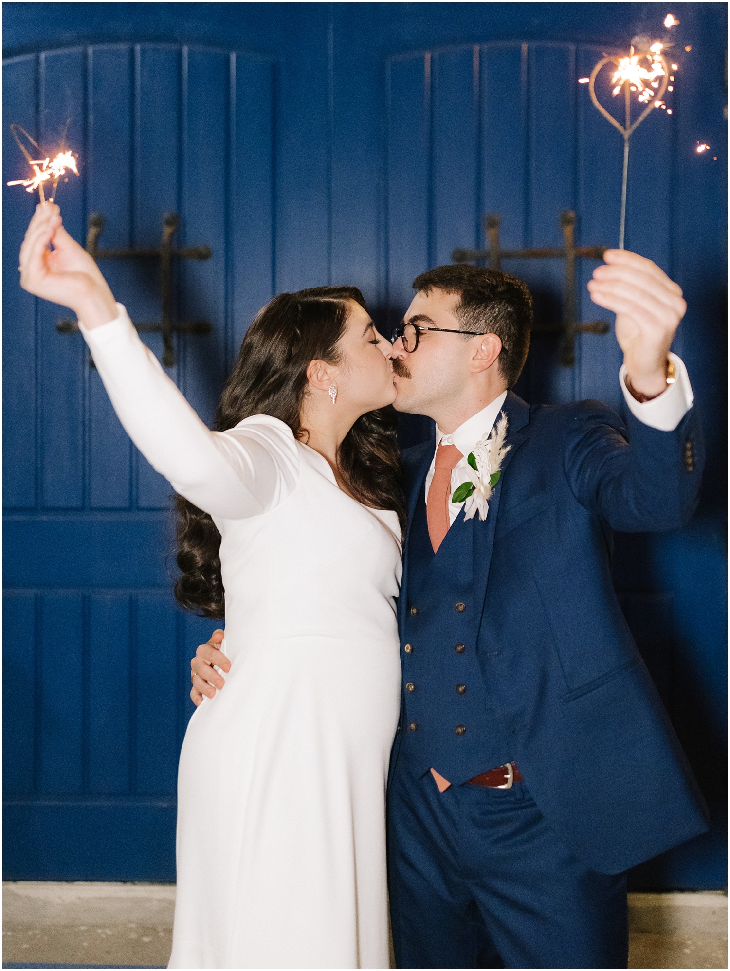 Couple says goodbye to friends on their wedding day with sparklers at The Rialto Theatre in Tampa, FL.