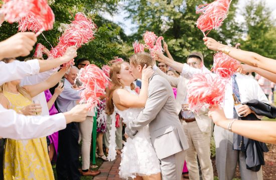 A couple celebrates with the wedding guests at Merrimon Wynne House in Raleigh, NC