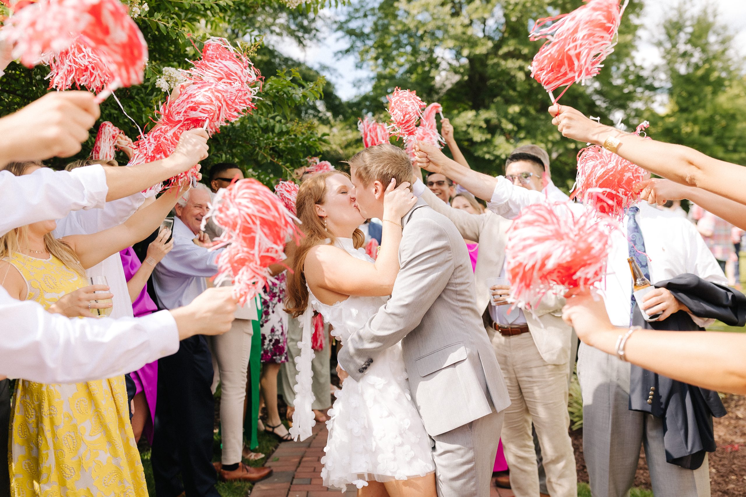 A couple celebrates with the wedding guests at Merrimon Wynne House in Raleigh, NC