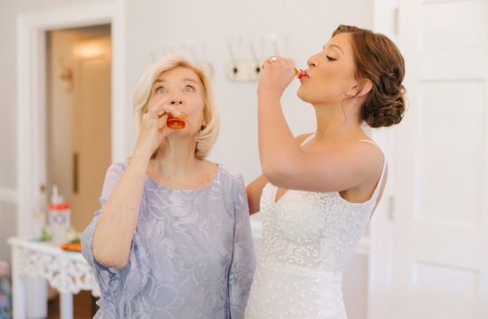 The bride and her grandma do a shot of Fireball on her wedding day at Separk Mansion in Gastonia, NC