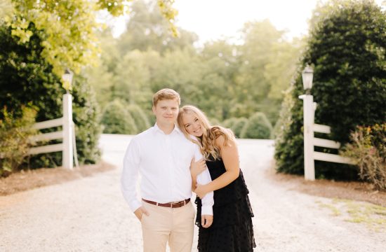 A couple hugs at Vesuvius Vinyards in Iron Station, NC for their engagement photos